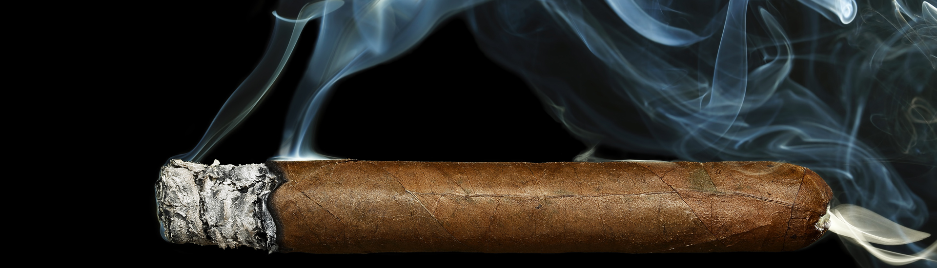 Cigar Burning With White Smoke